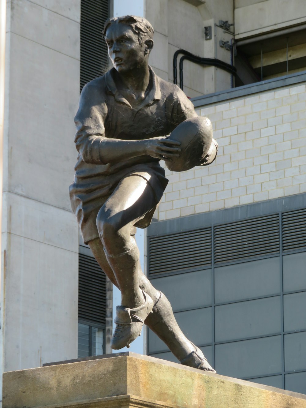 male rugby player statue
