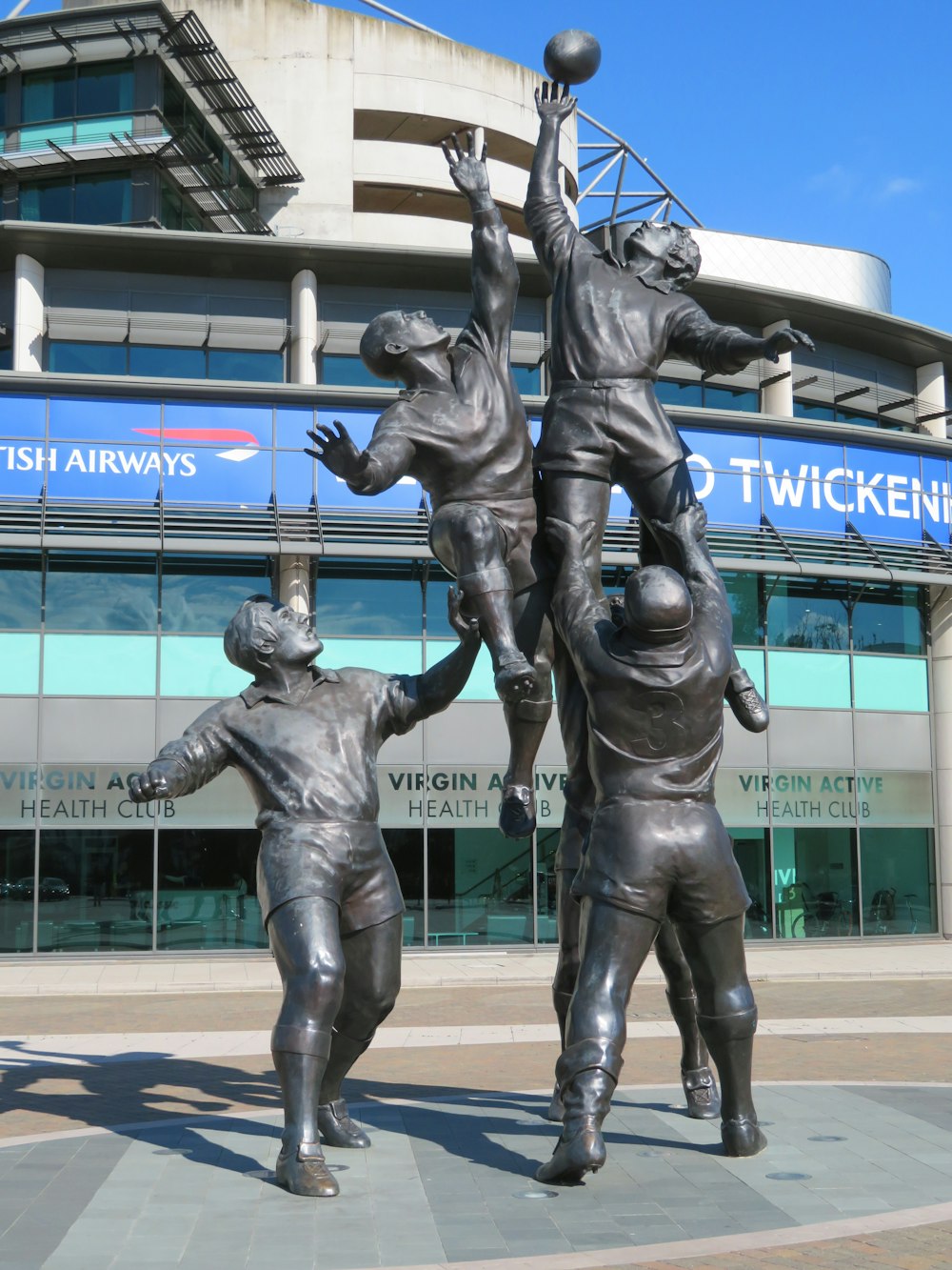 five men playing basketball