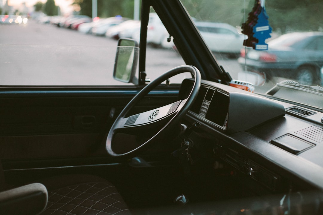 shallow focus photo of black steering wheel