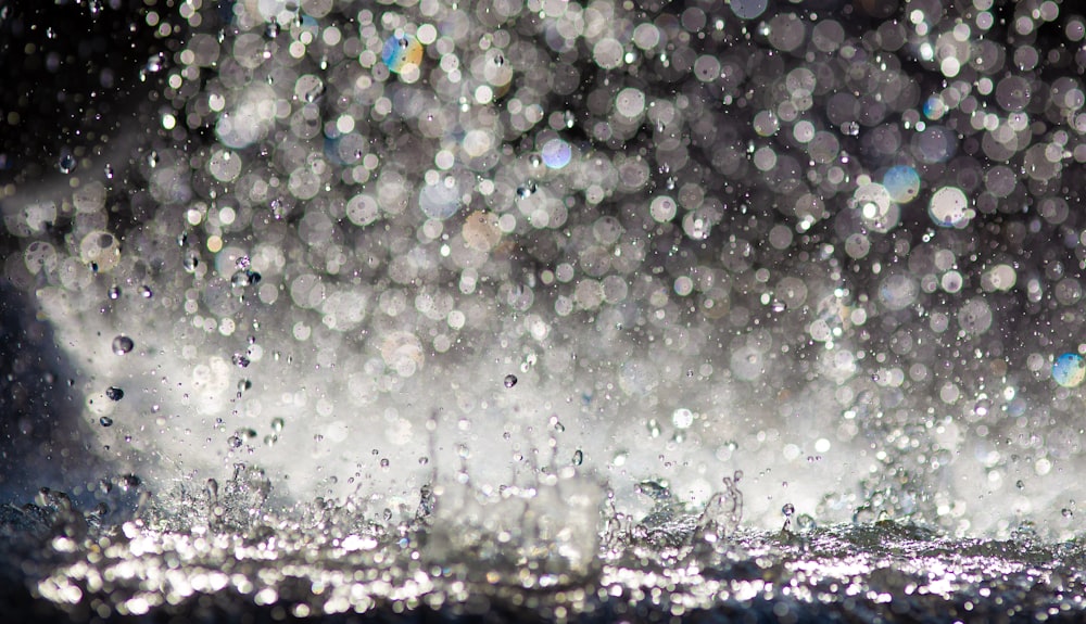 a close up of water droplets on a surface