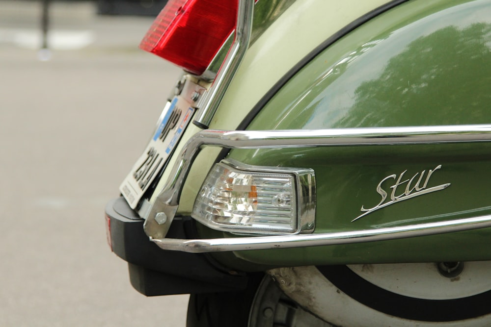 close-up photo of green scooter taillight
