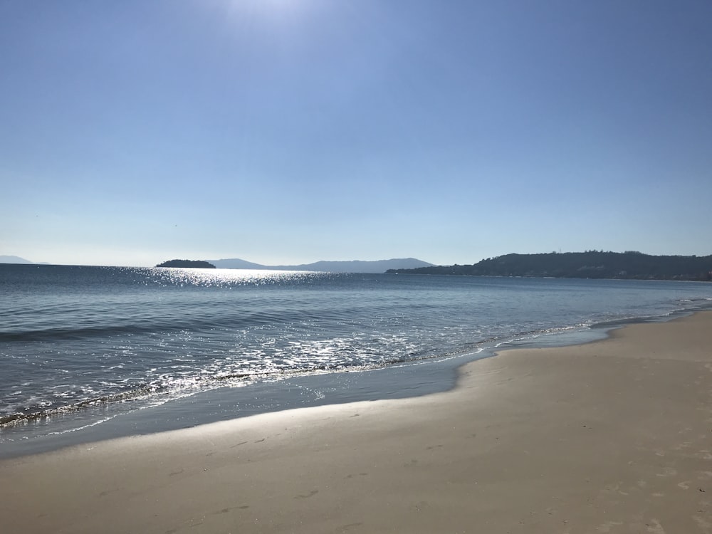 blue beach under blue sky