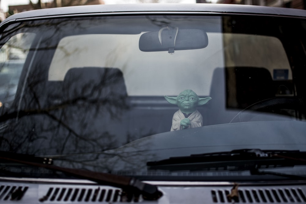Master Yoda action figure inside vehicle
