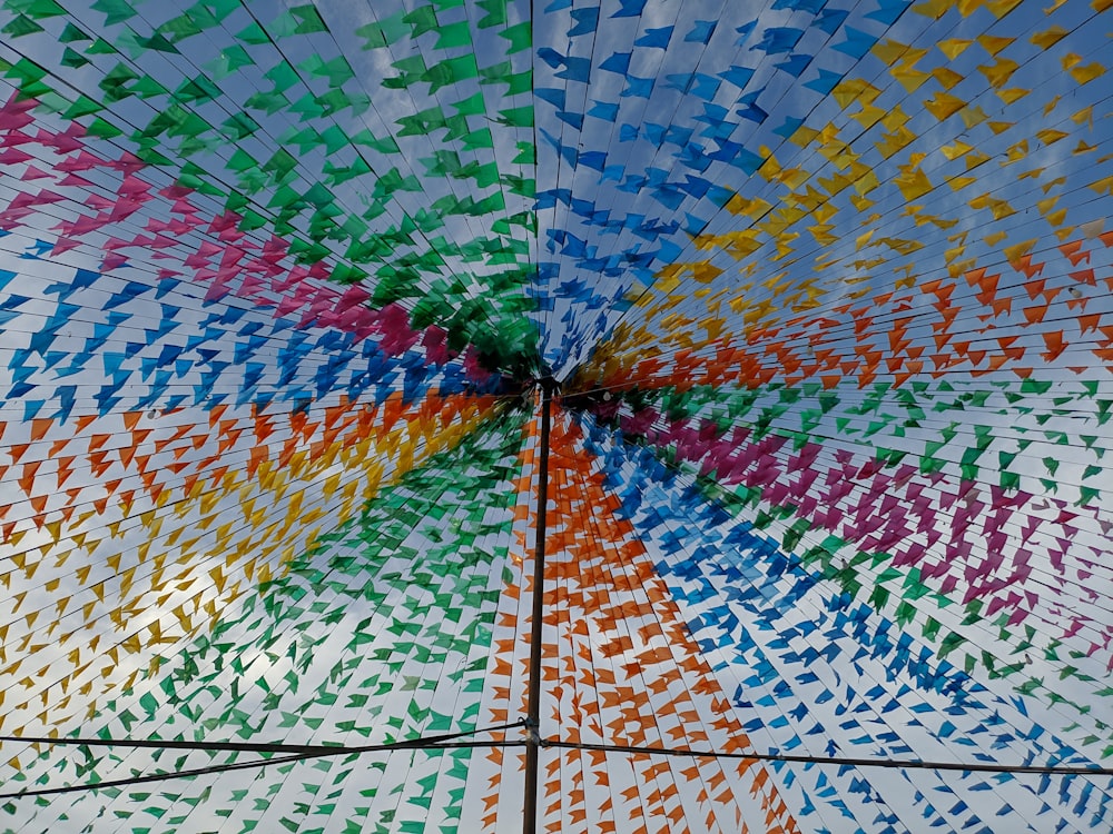 a multicolored umbrella with a white background