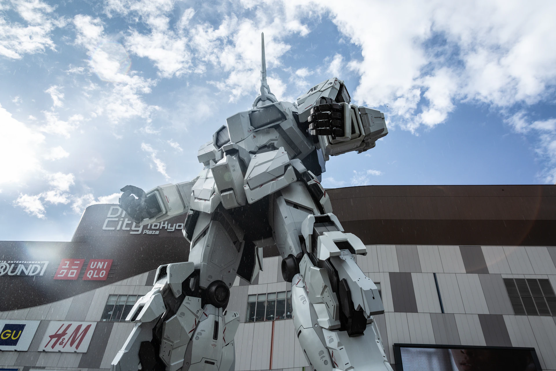 A service robot assisting visitors in a modern shopping mall with futuristic digital displays in the background.