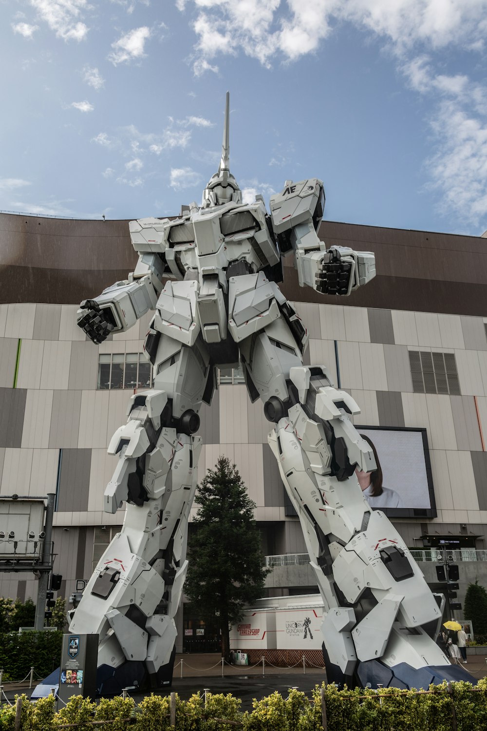 white Gundam statue in front of building