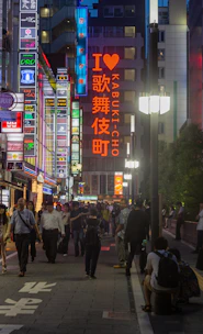A group of travelers enjoying a guided tour in bustling Shibuya, Tokyo, at sunset.