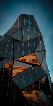 low angle photo of black curtain glass building
