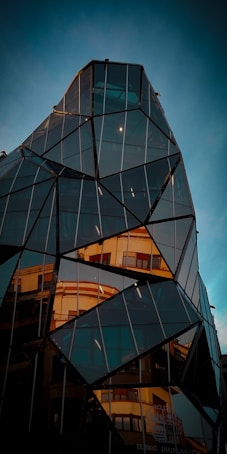 low angle photo of black curtain glass building