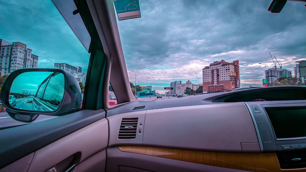 a view of a city from inside a car