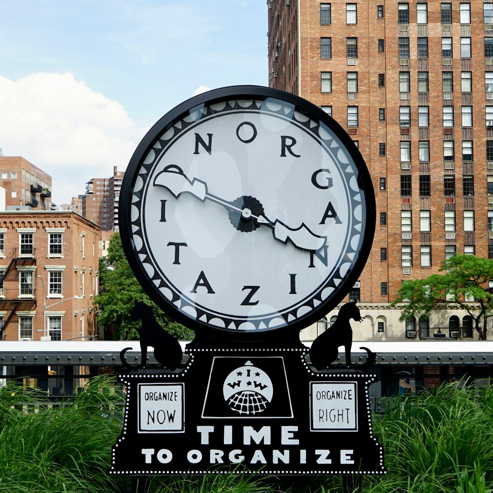 round black and white time to organize clock