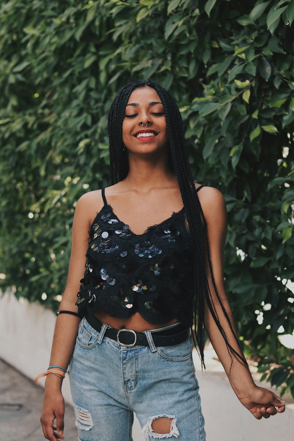 shallow focus photo of black spaghetti strap crop top