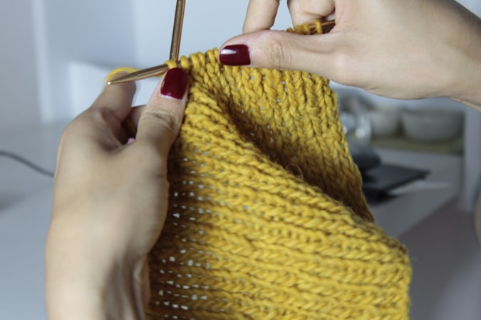 close-up of yellow hand-knitted textile pattern