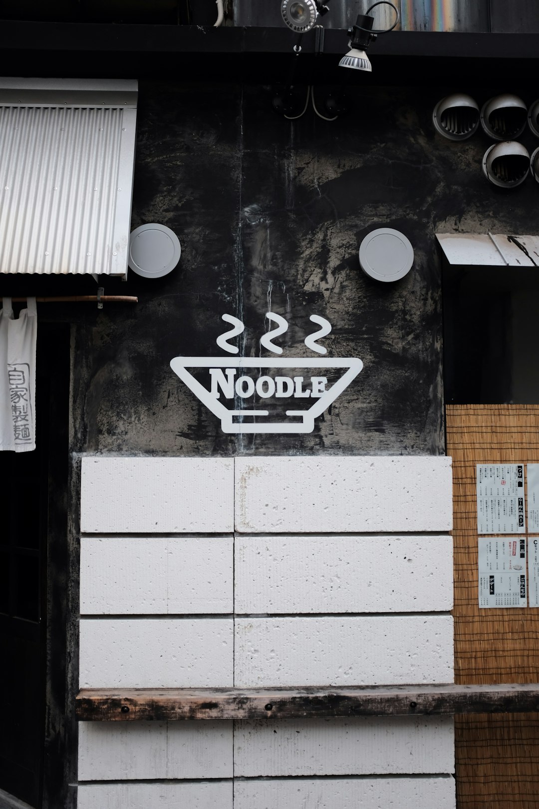 white and black noodle signage