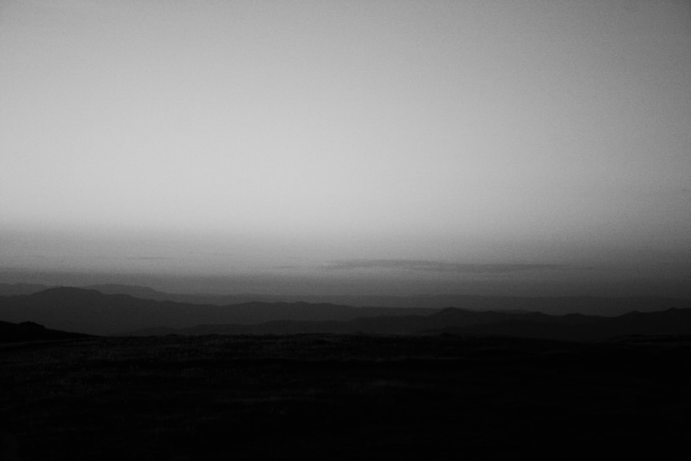 a black and white photo of a mountain range