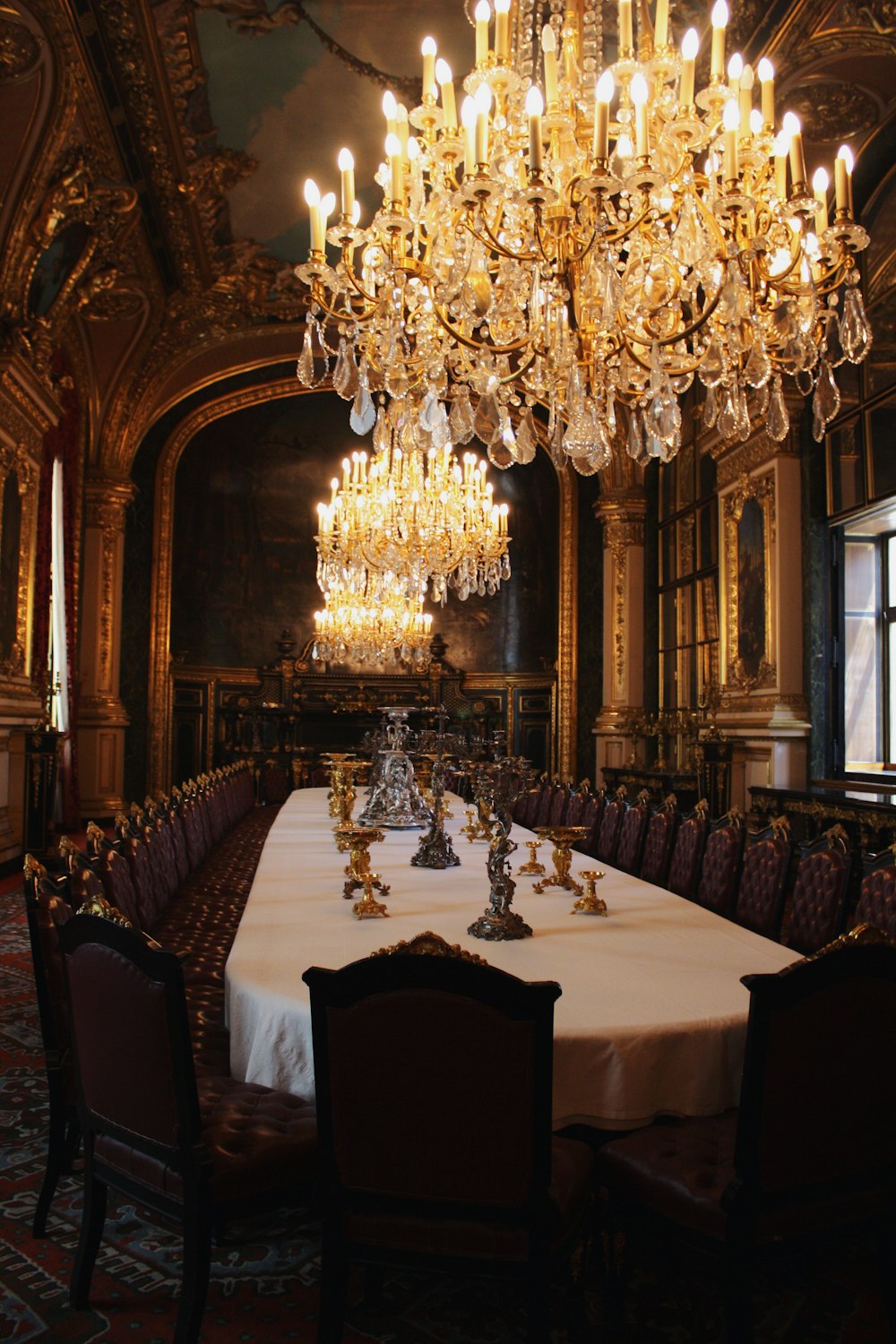 brown dining set with chandeliers