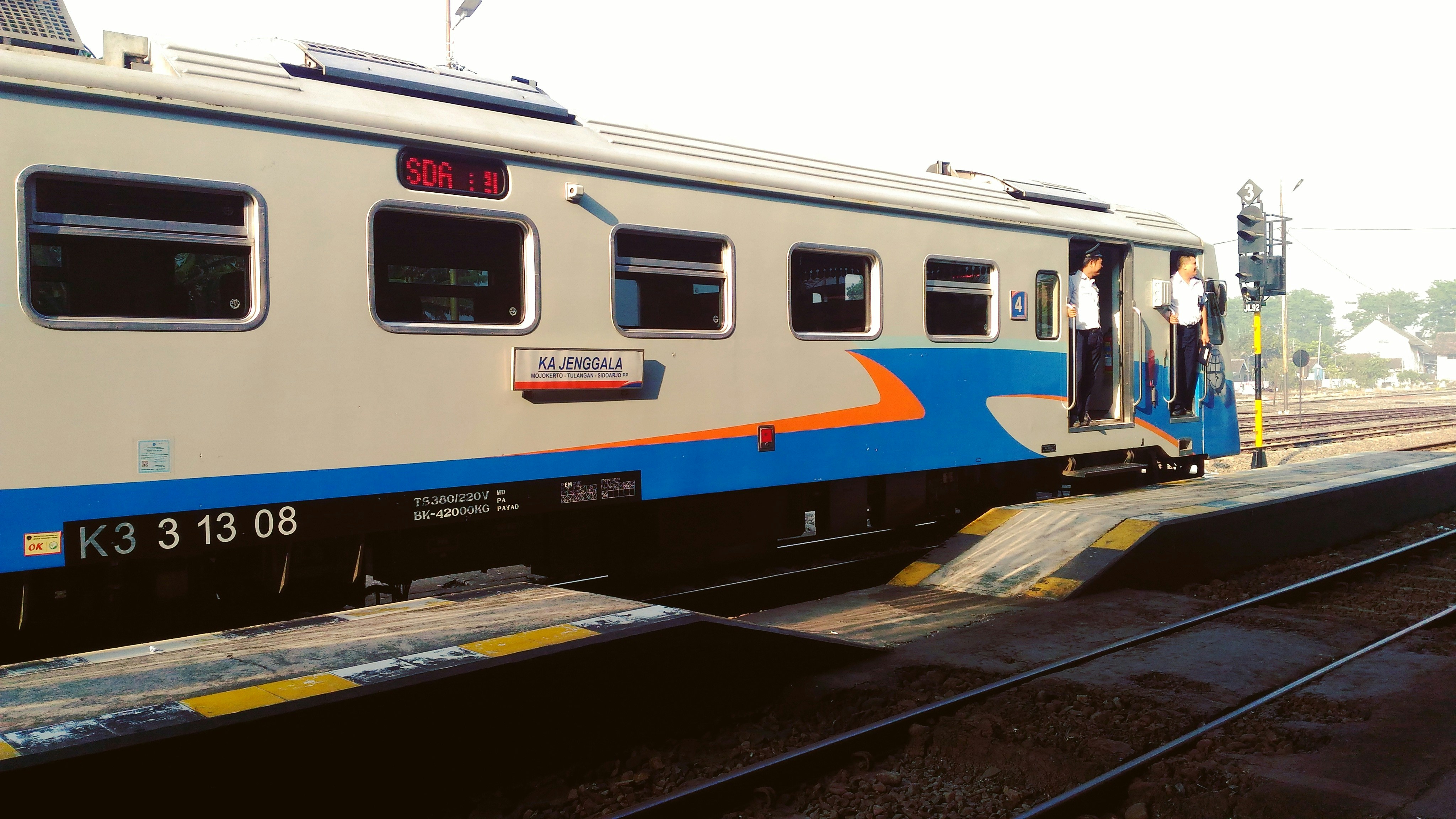 brown, blue, and red train