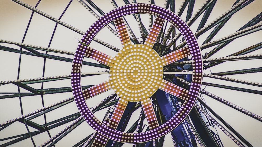 purple and yellow ferris wheel