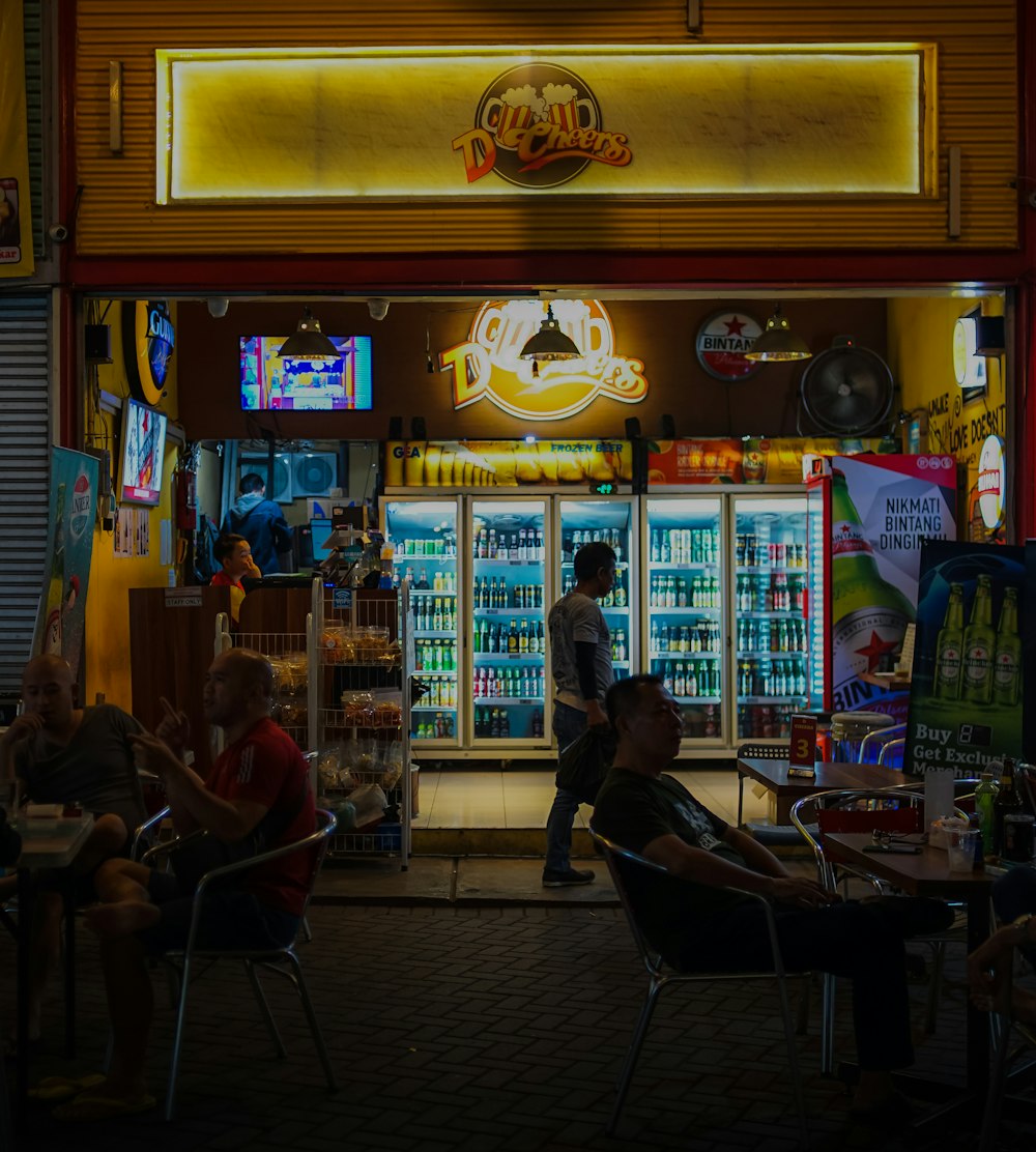 man sitting on chair beside store