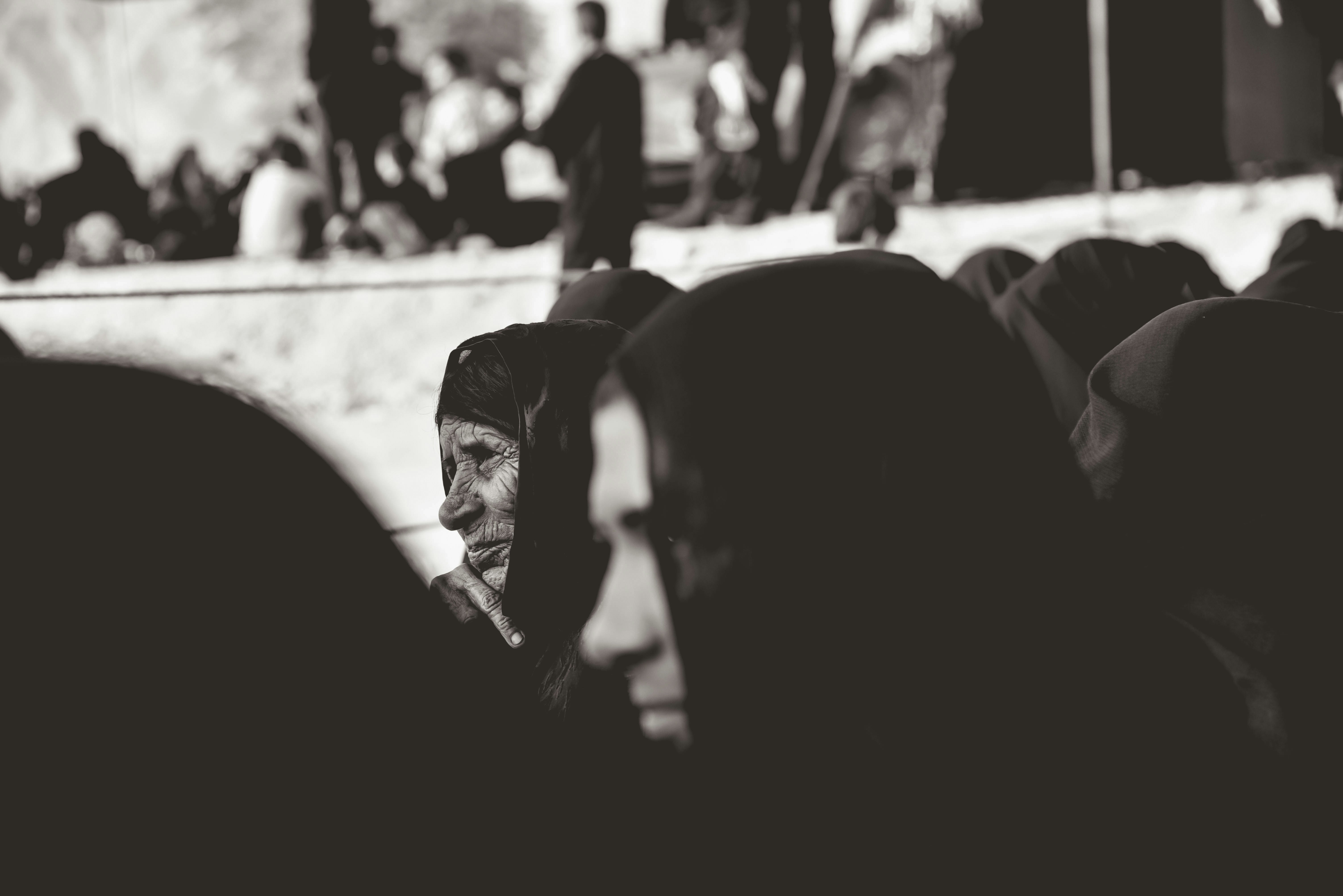 grayscale photography of people gathering in event