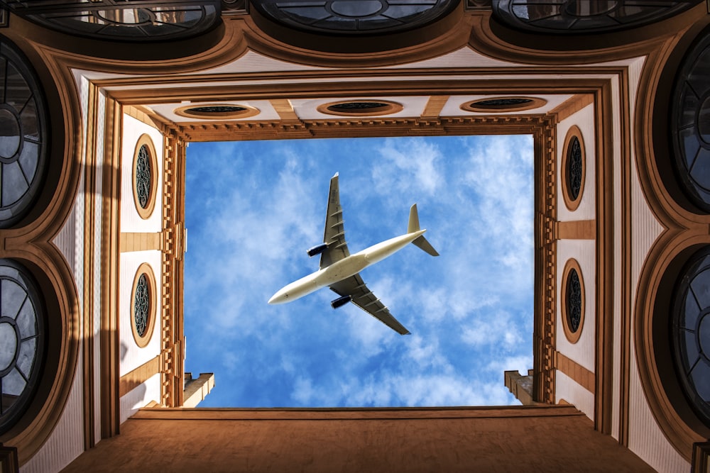 airliner above building