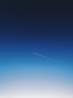 white smoke trail in the sky