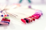 A close-up of a manicure station with colorful nail polishes.
