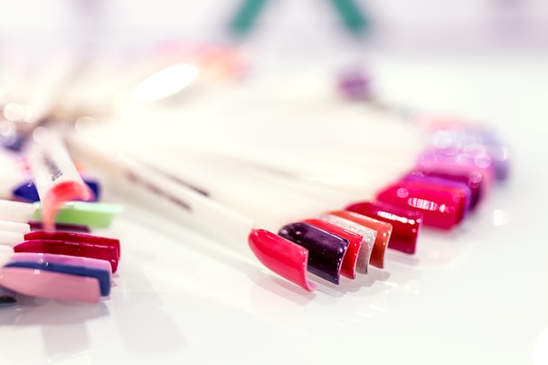Various nail polish colors displayed on a table.