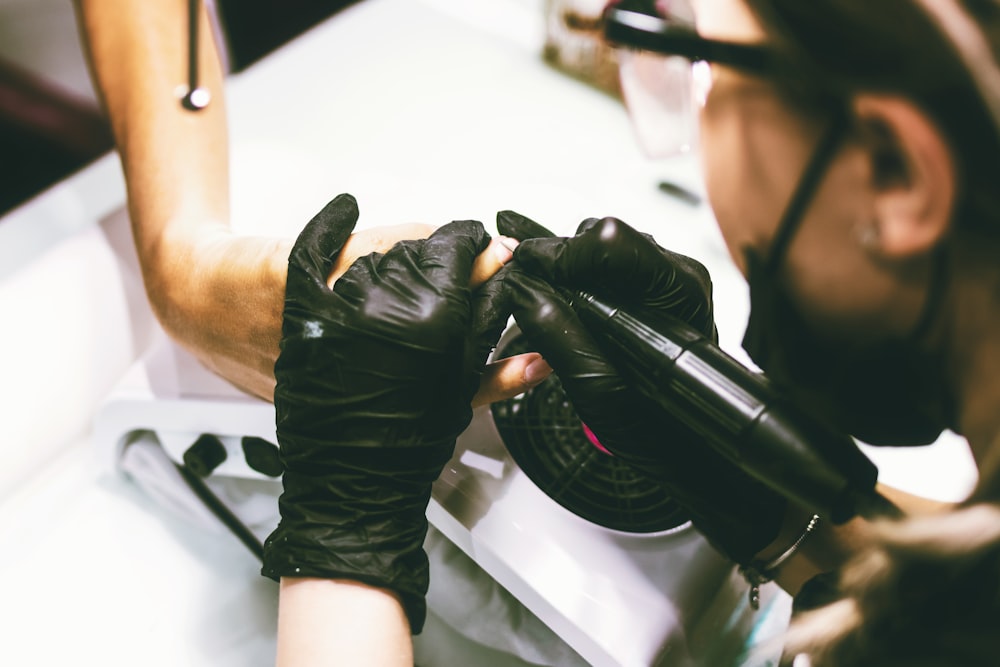 person tattooing