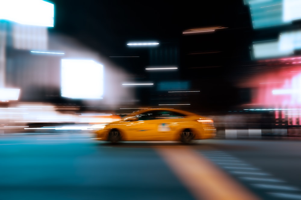 yellow car on road