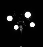 grayscale photography of lighted lamp post