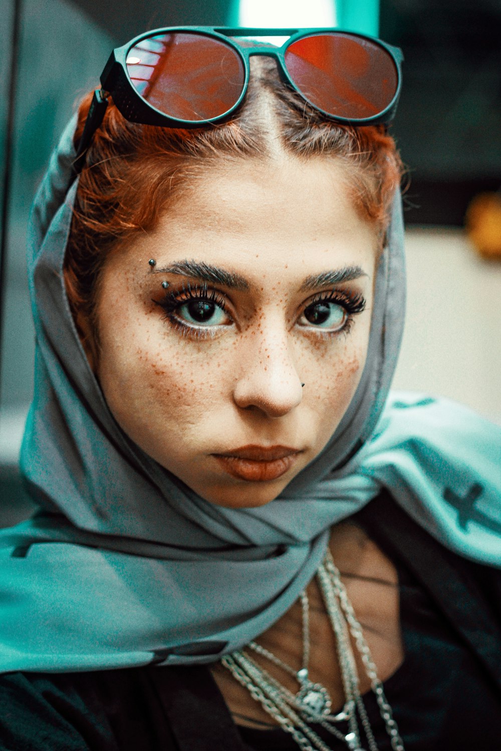 woman wearing gray hijab and gray sunglasses