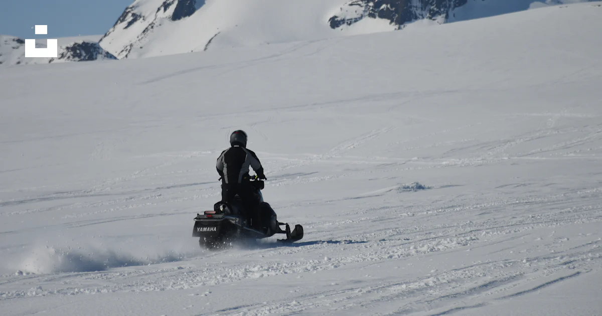 Person riding snowmobile photo – Free Ice Image on Unsplash