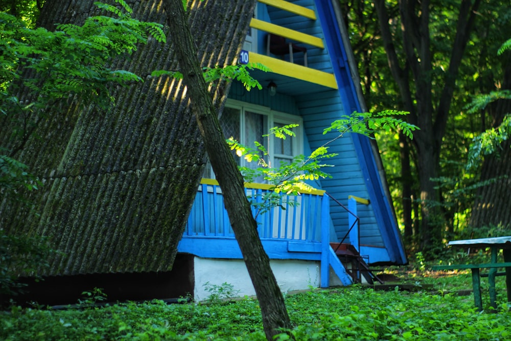 blue painted house with slanted roofs