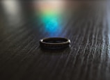 Close-up of a sapphire ring catching the light in a cozy studio.