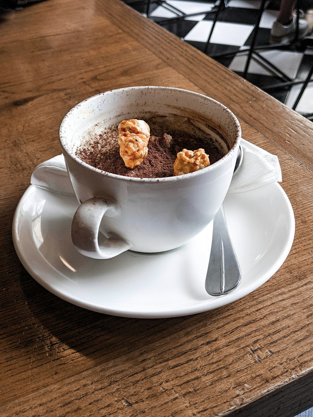 white ceramic cup on saucer on the table