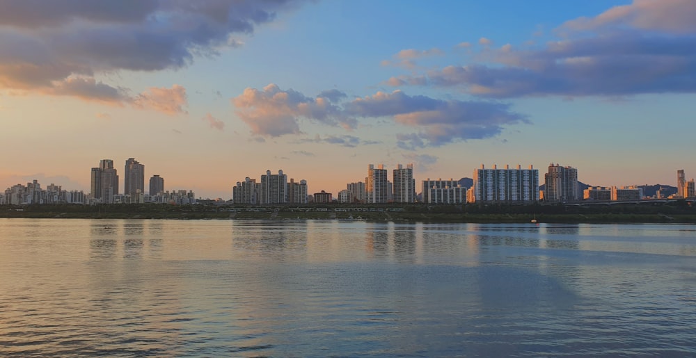 landscape photography of body of water near buildings
