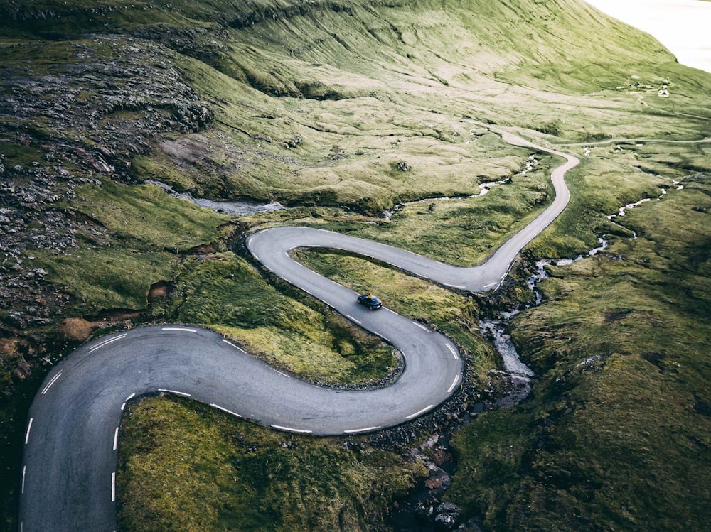 aerial photo of black on road during daytime