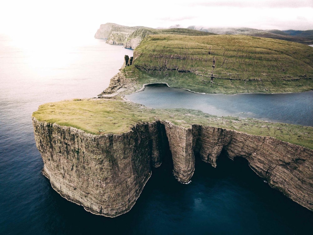 aerial photo of cliff near ocean during daytime