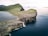aerial photo of island near ocean during daytime