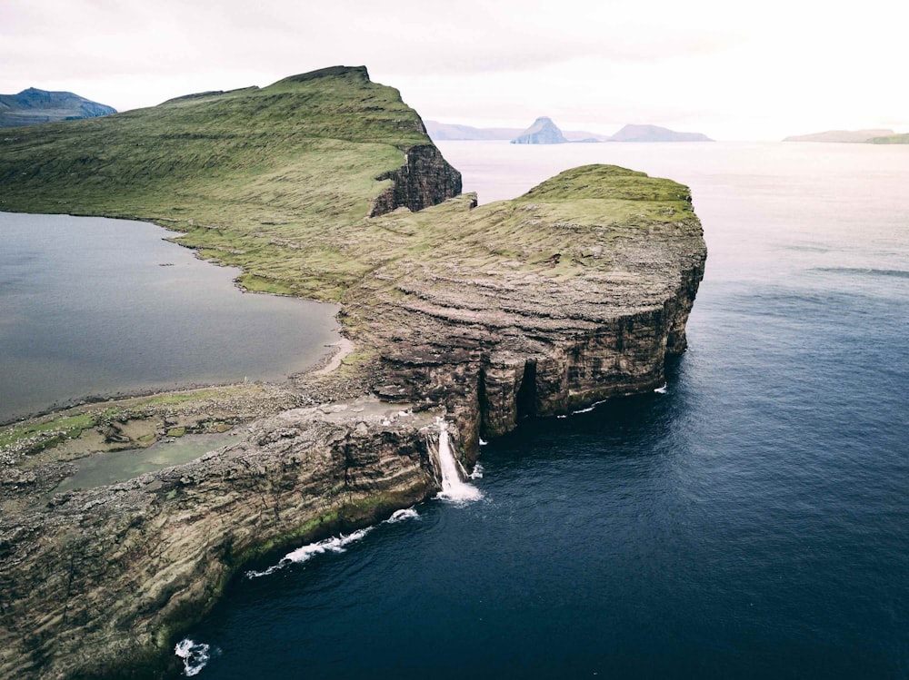 aerial photo of island near ocean during daytime