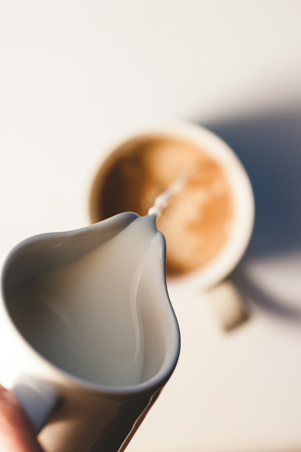 white ceramic teapot