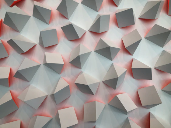 An elegant isometric cube pattern subtly layered behind a sleek office interior, highlighted in brand purple and grey tones.