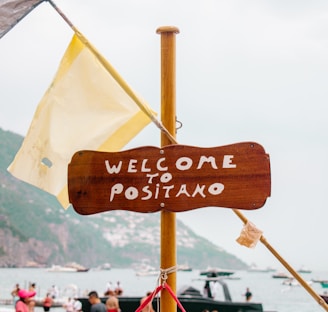 welcome to positano sign