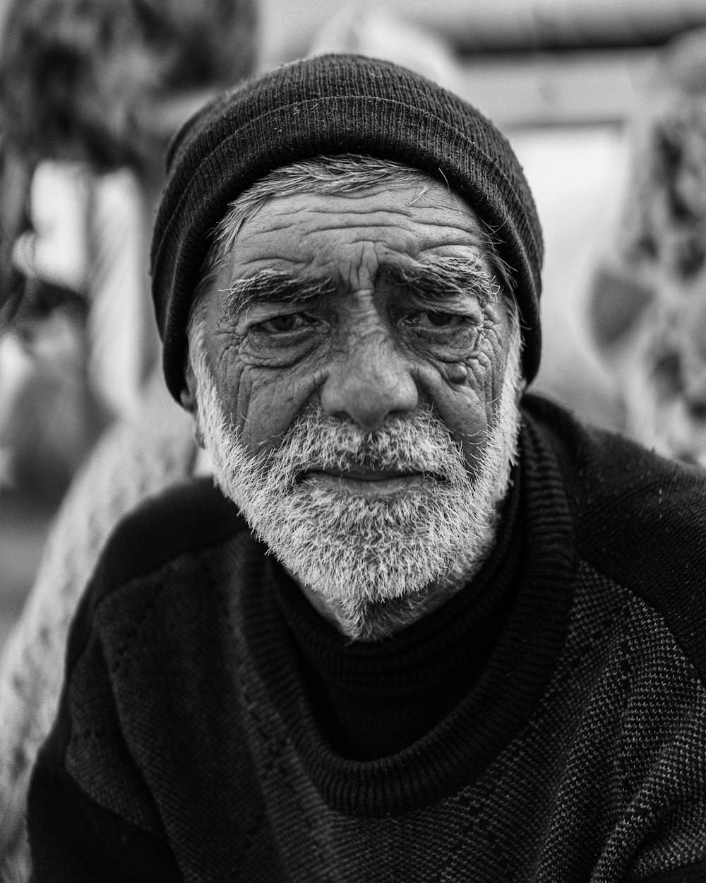 grayscale photo of man in knit cap