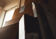 boxes leaning on cardboard box