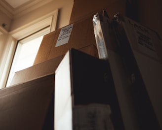 boxes leaning on cardboard box