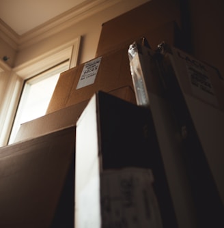 boxes leaning on cardboard box