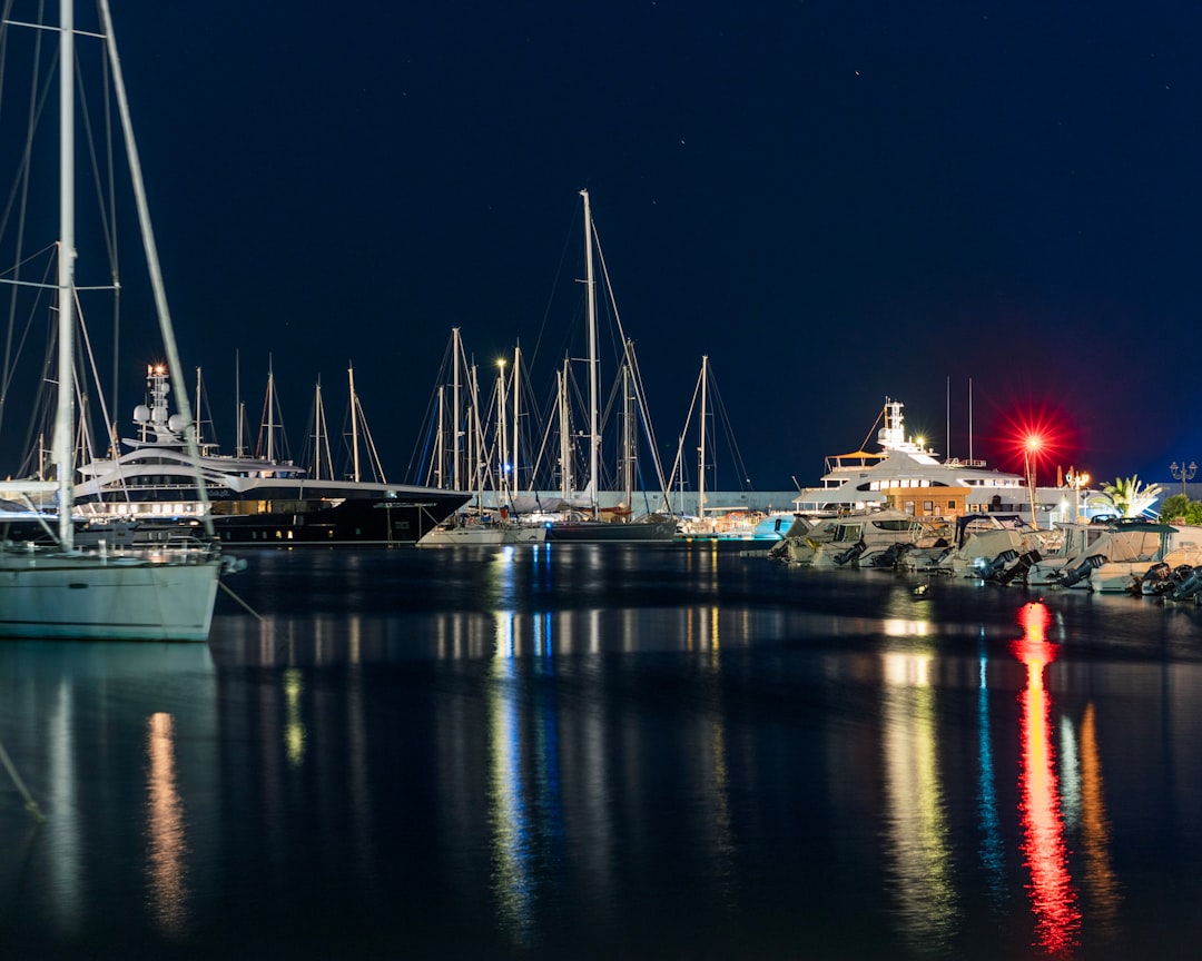 boat on calm body of water at night