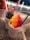A vibrant assortment of tropical fruits and colorful shaved ice toppings arranged beautifully.
